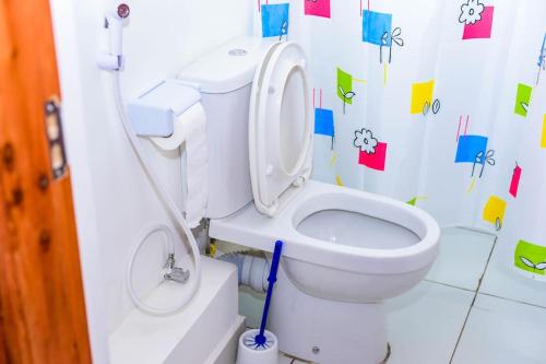 a bathroom with a toilet in a childs room at Double A Unique Homes in Mombasa