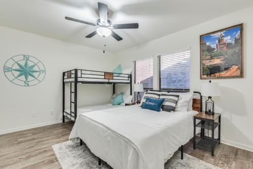 a bedroom with a bed and a ceiling fan at Comal Condo - Riverfont Complex Across from Schlitterbahn in New Braunfels