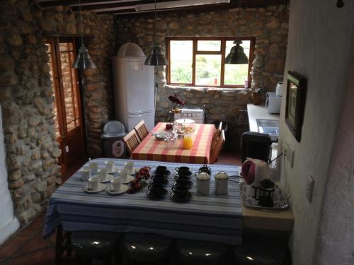 a room with a table with a chess game on it at Oaksrest Vineyards Guest Farm in Ladismith