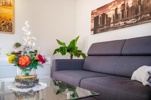 a living room with a couch and a glass table at Haus Heidorn in Sittensen