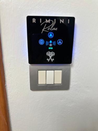 a lightswitch on a wall in a room at Residence Rimini Relax in Rimini
