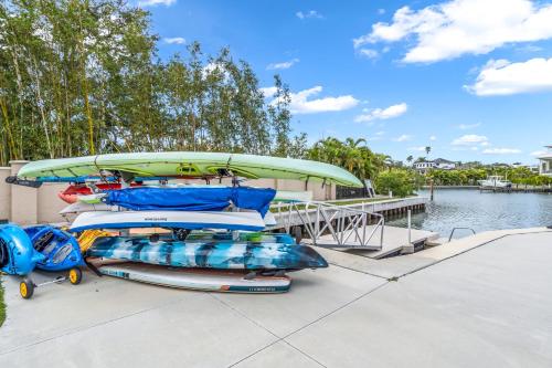 a group of inflatables on a dock next to the water at Waterside Retreat: Modern 2BR, Mins to Beach & Apt in Sarasota
