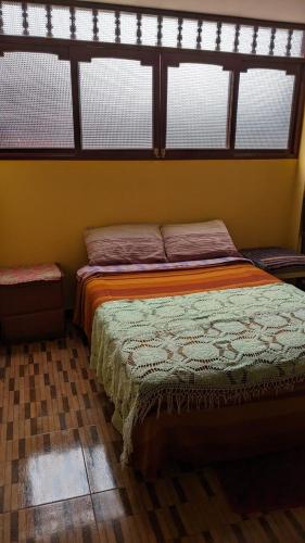 Una cama o camas en una habitación de Guiltor host