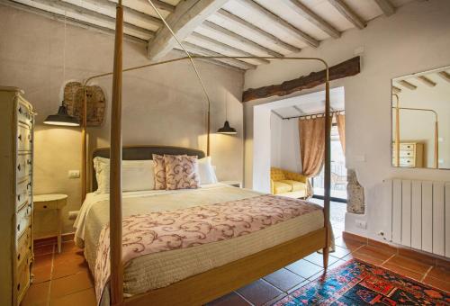 Postel nebo postele na pokoji v ubytování Castello Di Tornano Wine Relais