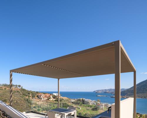 a pavilion with a view of the ocean at Cueva Villas, with Pool, SeaViews & close to Sea, By ThinkVilla in Balíon