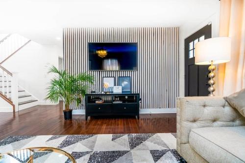 a living room with a couch and a table at East Atlanta / Decatur retreat with fire-pit in Decatur