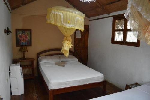 En eller flere senge i et værelse på Hosteria Cabanas Itapoa