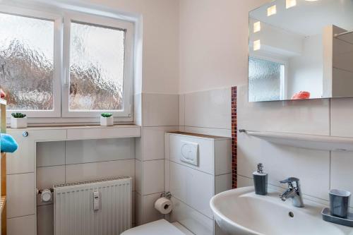 Ένα μπάνιο στο Ferienwohnung Alpenglück