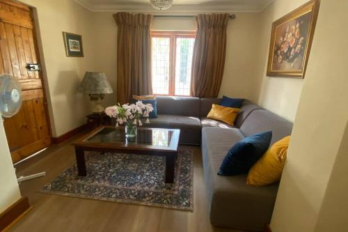 a living room with a couch and a coffee table at Lekkalê in Robertson