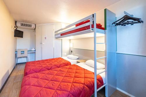 a bedroom with two beds and a bunk bed at Premiere Classe Angers Beaucouzé in Beaucouzé