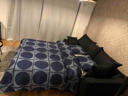 a bedroom with a bed and a couch at Charmant Studio in Geneva