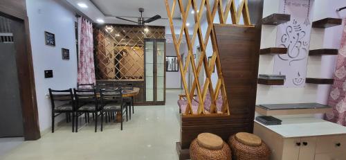 a dining room with a table and some chairs at Homestay-a better living in Lucknow