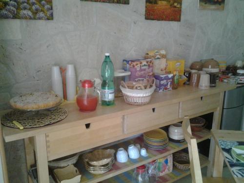 a table with food and drinks on top of it at B&B Uliveto del Gargano in Vieste