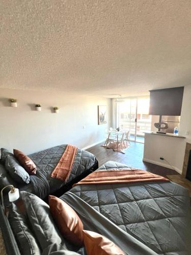a bedroom with a bed and a couch at Amazing Universal Studios Loft FREE parking in Los Angeles