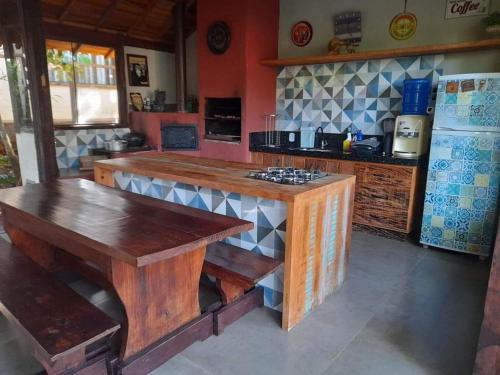 a kitchen with a wooden counter top and a refrigerator at Casa Rustica Dubanza in Bonito