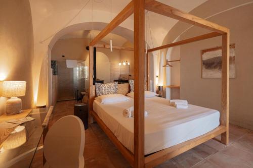 a bedroom with a canopy bed in a room at Casa Flora in Vietri sul Mare