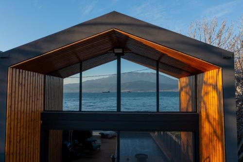 a house with a view of the water at Spa Villas Nafpaktos in Nafpaktos