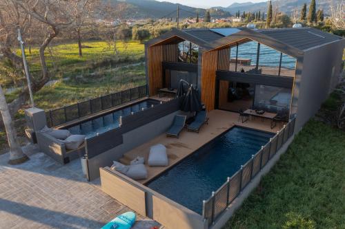 an image of a house with a swimming pool at Spa Villas Nafpaktos in Nafpaktos