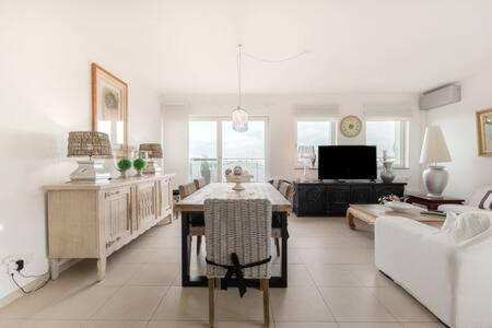 a living room with a couch and a table at Modern 2BR Apt in Sandweiler with Terrace in Sandweiler