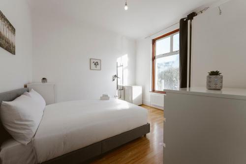 מיטה או מיטות בחדר ב-Stratford Double Rooms - 29