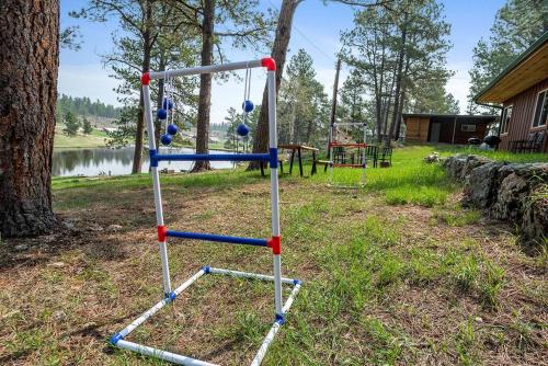a swing set with balls on it in a park at Modern Lodge- BHBungalows Main in Custer