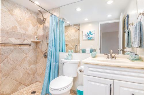a bathroom with a toilet and a sink and a shower at ***SERENDIPITY ON THE MOANA - Legal & Oceanfront - Great for Work & Play!*** in Waianae