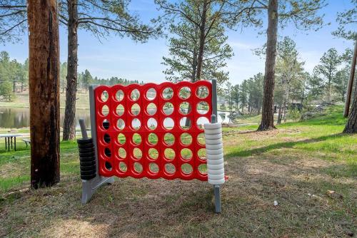 a large red and white game in a park at Hottub Hideaway BHBungalows #6 in Custer