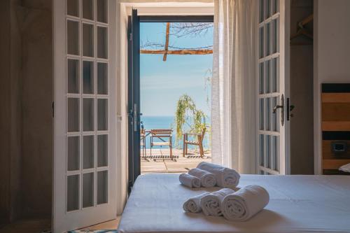 a bedroom with a bed with a view of the ocean at Casa Flora B&B in Vietri