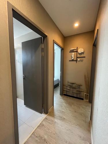 a hallway with a door open to a room at Sea View 2 Bed Room Condo @ Central Pattaya in Pattaya Central