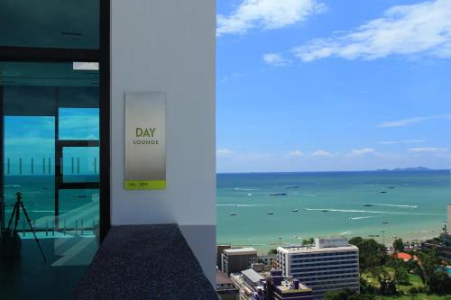 a view of the ocean from a building at Sea View 2 Bed Room Condo @ Central Pattaya in Pattaya Central