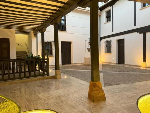 an empty courtyard of a building with columns at MANZANO PALACE. Apartamentos con Terraza in Almagro