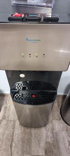 a close up of a kitchen appliance with a mixing bowl at Μεγάλος χώρος με Γυμναστήριο-Χαμάμ-Κρεβάτι-Γραφείο in Krionérion