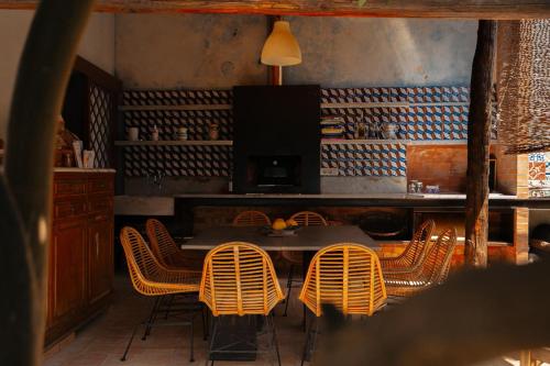 a dining room with a table and chairs at Casa Flora in Vietri sul Mare