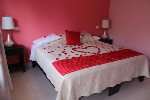 Postel nebo postele na pokoji v ubytování Hotel Boutique La Orquidea