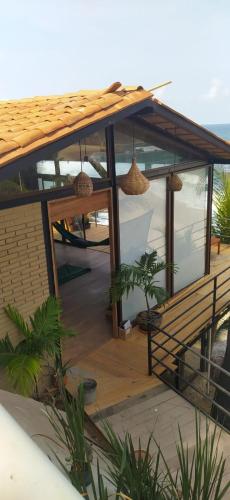 a house with a view of the ocean at Hotel Bendita Luna Salchi in Cuatunalco