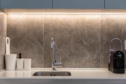 a kitchen counter with a sink at Apartments Royal - Belgrade Waterfront in Belgrade