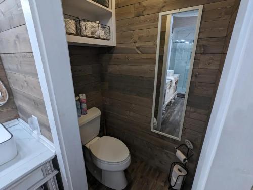a bathroom with a toilet and a sink at Robbins Nest in South Toledo Bend