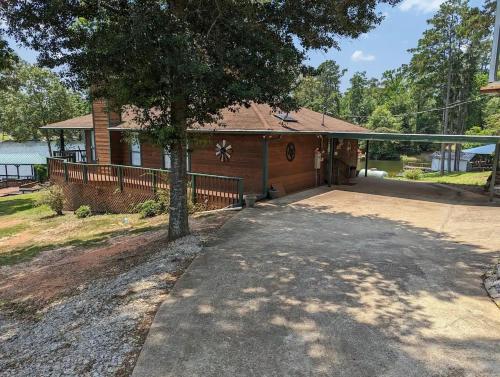 a house with a tree in front of it at Robbins Nest in South Toledo Bend