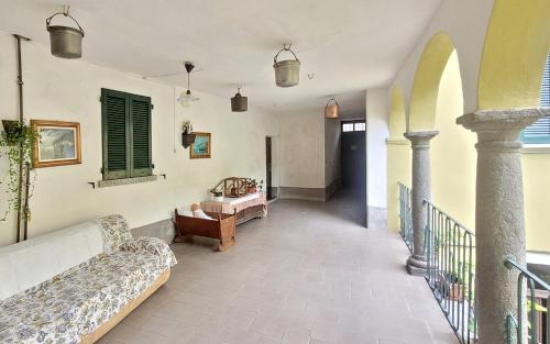 a living room with a couch and a table at La corte di via Chiarello in Taceno