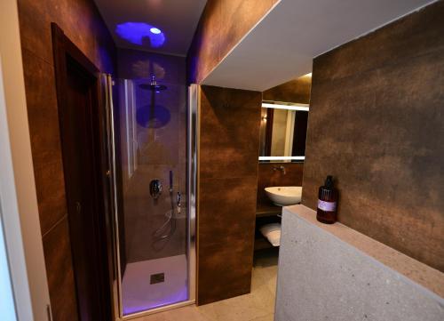 a bathroom with a shower and a sink at Xenia Neapolis in Naples