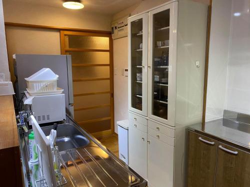 a kitchen with a sink and a dishwasher at SlowTime - Vacation STAY 75364v in Shima