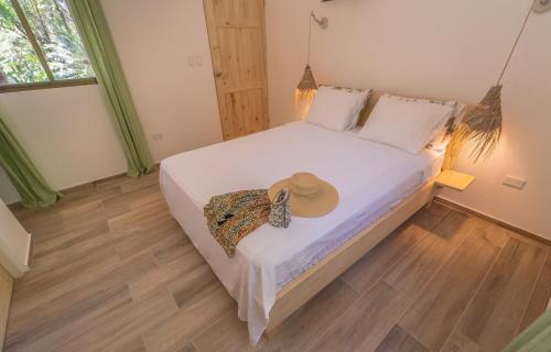 Una cama o camas en una habitación de Hotel Entre Dos Aguas