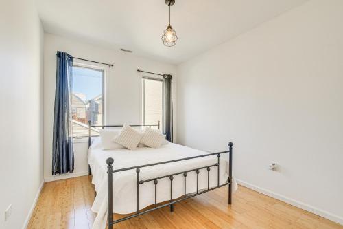 a bedroom with a bed and a large window at Bright Chicago Home with Backyard Less Than 5 Mi to Downtown in Chicago