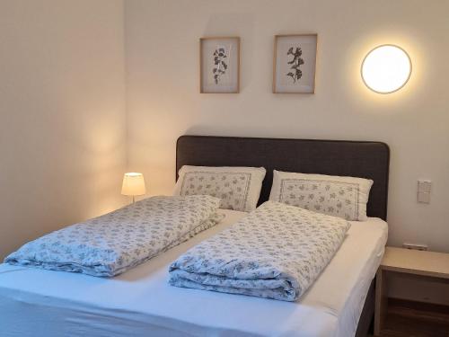 Katil atau katil-katil dalam bilik di Barrierefreies Apartment Ursulinenhof