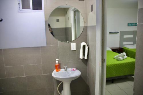 a bathroom with a sink and a mirror at Villa Stahl in San Salvador