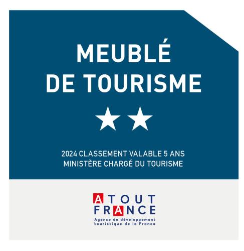 a blue sign with white stars and the text module de tourism at Cœur de Fontainebleau: Confort, Calme & Haut débit in Fontainebleau