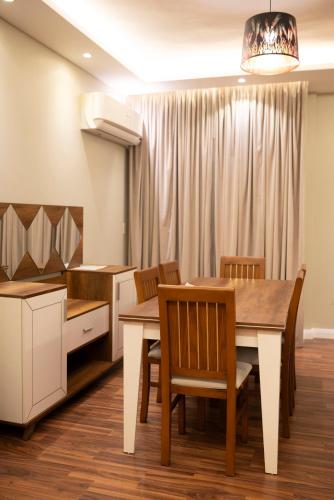 a kitchen and dining room with a table and chairs at Munir’s residence in Cairo