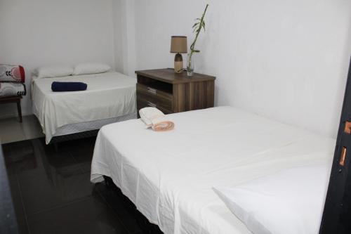 Postel nebo postele na pokoji v ubytování Ap 90 O´ H Apart