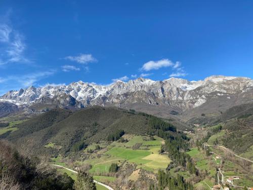 a view of a mountain range with snow covered mountains at Apartamentos Calm & Nature - Adults Only in Cabezón de Liébana