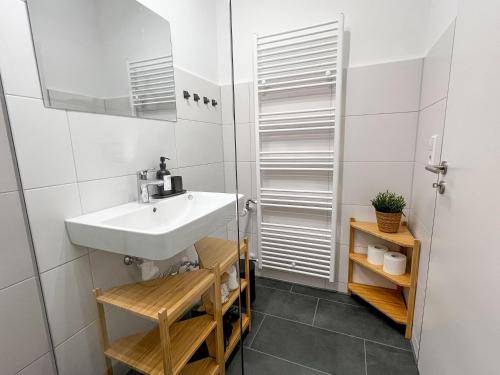 a bathroom with a sink and a mirror at Feldbergblick mit Schwimmbad und Sauna in Lenzkirch